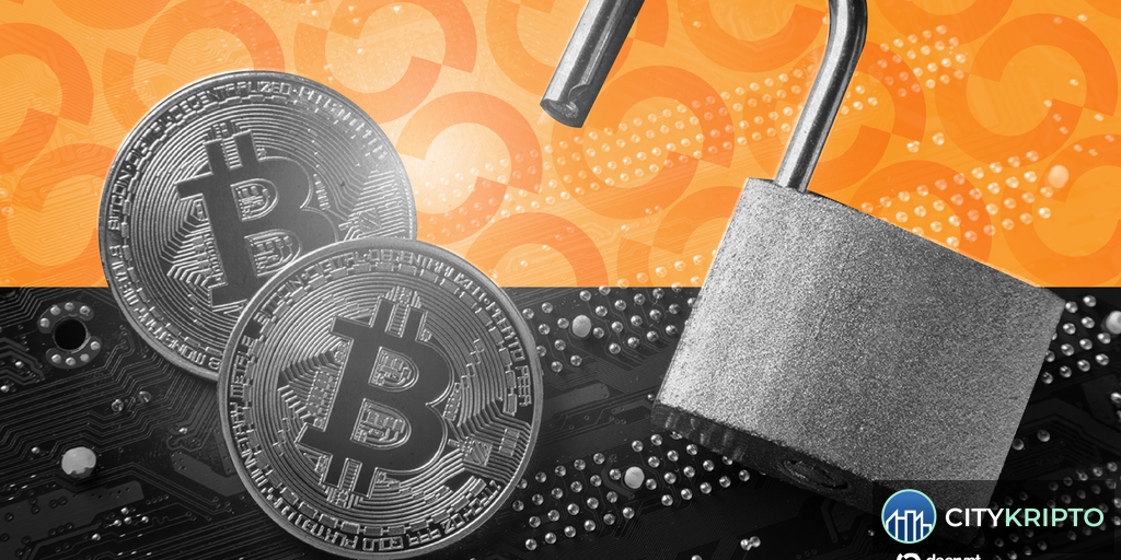 Аппаратный кошелек Coldcard с биткоинами на фоне графиков