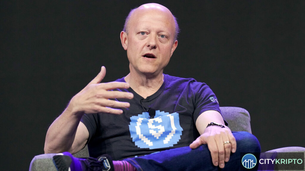 Логотипы Binance и Circle на фоне графика криптовалют, символизирующие сделку по USDC