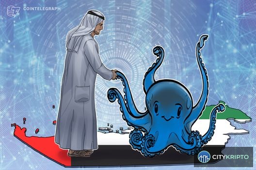 Логотип Kraken на фоне небоскребов Дубая